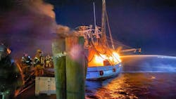 Fire engulfs one of the Mayport shrimp boats as Jacksonville, FL, firefighters battle the blaze.