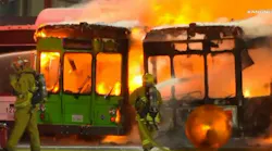 Firefighters battled flames after two empty passenger buses caught fire at Los Angeles International Airport on Saturday night.