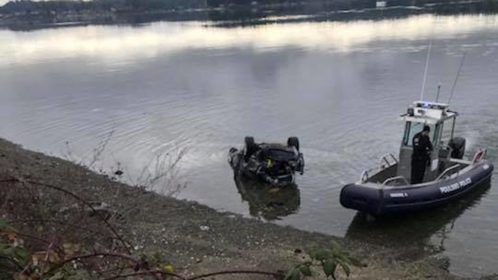 Polusbo, WA, firefighters rescued a couple who were trapped in their vehicle after it crashed into Liberty Bay on Saturday.