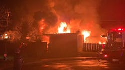 A Reedley, CA, firefighter was injured when his foot was impaled on a Christmas tree stand while battling a massive house fire Sunday night.