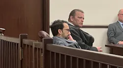 Former Utica, NY, firefighter Richard Forte (right) listens at his sentencing at Utica City Court on Monday.