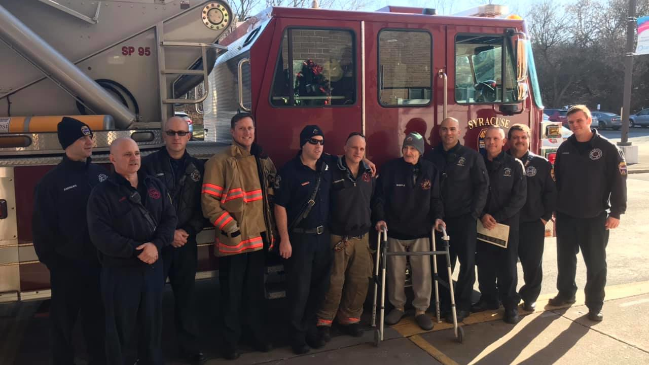 Syracuse, NY, firefighters spent Christmas Eve with retired firefighter Andy Whipple at the retirement where he lives.