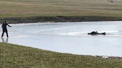 East Wayne, OH, firefighters work to rescue a man and his two grandsons after they fell through ice at a small pond near the village of Dalton on Sunday. East Wayne, OH, firefighters work to rescue a man and his two grandsons after they fell through ice at a small pond near the village of Dalton on Sunday.