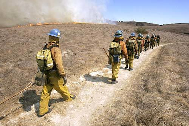 Los Angeles County firefighters work a wildfire.