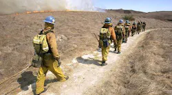 Los Angeles County firefighters work a wildfire.