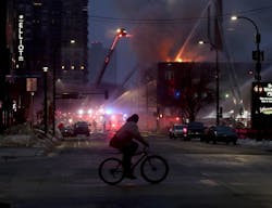 The four-alarm fire started on the second floor of the downtown hotel for homeless people.