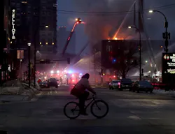 The four-alarm fire started on the second floor of the downtown hotel for homeless people.