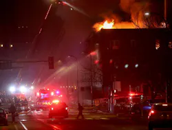 Fire shoots from the attic of the Francis Drake Hotel in downtown Minneapolis.