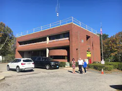 Town officials and Plymouth Fire Chief Ed Bradley visit the headquarters fire station in October.