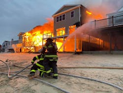 Flames engulfed two homes on the beach in Old Saybrook.