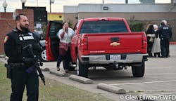 Law enforcement watch over the scene and comfort people at the scene of the deadly church shooting. Law enforcement watch over the scene and comfort people at the scene of the deadly church shooting.