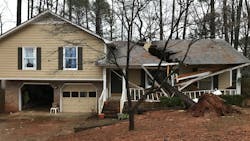 A fallen tree damaged a house in Madison, AL, as severe weather moved through the South and the Midwest over the weekend. A fallen tree damaged a house in Madison, AL, as severe weather moved through the South and the Midwest over the weekend.