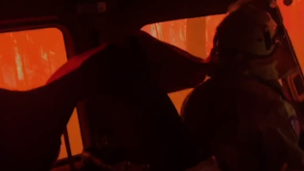 Australian firefighters escaped a deadly burnover that consumed their apparatus while battling a bushfire in New South Wales on Tuesday.