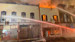 Firefighters from Boonviille, NY, and six other departments battle an overnight blaze that burned at least three buildings Tuesday and displaced multiple families.