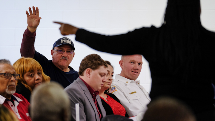 A volunteer firefighter asks a question during a town hall meeting at Buena Vista Community Center to discuss a possible police-fire merger on Jan. 3, 2020.