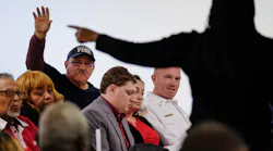 A volunteer firefighter asks a question during a town hall meeting at Buena Vista Community Center to discuss a possible police-fire merger on Jan. 3, 2020.