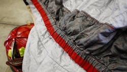 A new fire jacket, with an added interior skirt to keep out smoke and other particulate matter, is shown at the Columbus, OH, Fire Training Academy. A new fire jacket, with an added interior skirt to keep out smoke and other particulate matter, is shown at the Columbus, OH, Fire Training Academy.