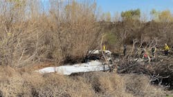 Corona, CA, firefighters put out the flames of a fiery airplane crash that killed four people Thursday.