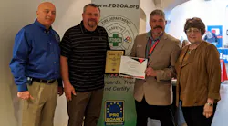 EVT of the Year Award winner Brian Marek, second from left, poses with, from left, FDSOA Executive Director Rich Marinucci, OEM Accounts Manager for Spartan Motors Jeff Seal, and Janet Wilmoth, Special Projects Director for Firehouse, at the FDSOA conference in Scottsdale, AZ.