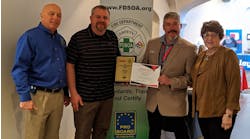 EVT of the Year Award winner Brian Marek, second from left, poses with, from left, FDSOA Executive Director Rich Marinucci, OEM Accounts Manager for Spartan Motors Jeff Seal, and Janet Wilmoth, Special Projects Director for Firehouse, at the FDSOA conference in Scottsdale, AZ.