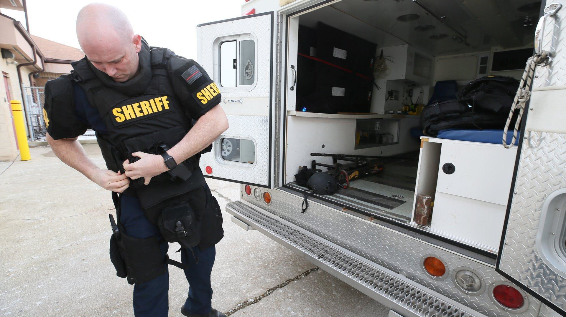Green, OH, Fire Lt. Michael Mohr suits up with the gear he wears while working as a paramedic with the Summit County sheriff&rsquo;s SWAT team. Mohr and other tactical paramedics wear the same uniform as other SWAT members.