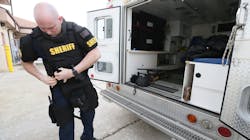 Green, OH, Fire Lt. Michael Mohr suits up with the gear he wears while working as a paramedic with the Summit County sheriff’s SWAT team. Mohr and other tactical paramedics wear the same uniform as other SWAT members. Green, OH, Fire Lt. Michael Mohr suits up with the gear he wears while working as a paramedic with the Summit County sheriff’s SWAT team. Mohr and other tactical paramedics wear the same uniform as other SWAT members.