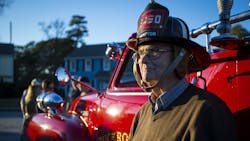 Robert J. Smith dons his firefighter&apos;s helmet at his 90th birthday Saturday in Hampton, VA. Smith began his career as a firefighter before firefighters wore oxygen tanks as they do now.