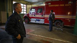 Hartford, CT, Assistant Fire Chief Dan Reilly (left) and retired Chief Charles Teale stand in the department&apos;s historic Pearl Street firehouse.