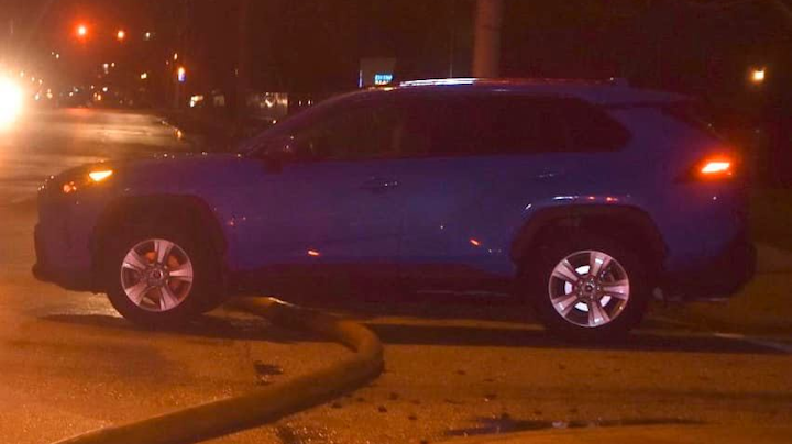 A motorist was ticketed and ordered to wait until Indianapolis firefighters were finished working after parking over a hose in use at an active fire scene this weekend.