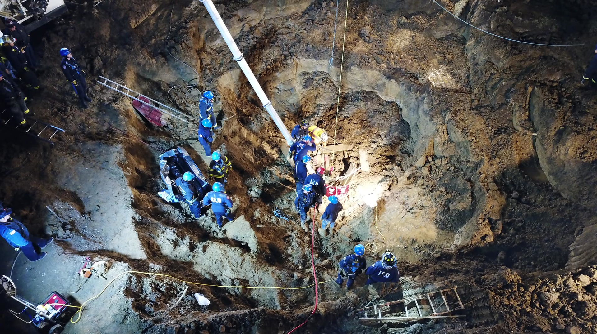 Indianapolis Fire Department's collapse rescue team worked for more than 10 hours to recover the body of a 56-year-old man who fell into a 15-foot-deep trench when the ground gave way while digging a well Monday.