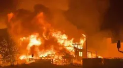 A pre-dawn, three-alarm fire destroyed a four-story apartment building under construction in Jacksonville, FL, on Sunday.