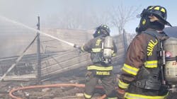 Firefighters from Do&ntilde;a Ana County&apos;s South Fire District work to put out a fire that destroyed a La Union, NM, mobile home Tuesday.