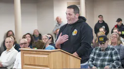 Middletown, RI, firefighter John Jordan, who heads the town's fire union, addresses the Middletown Town Council on Monday.
