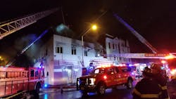 Around 65 Newark, NJ, firefighters battled a two-alarm blaze that broke out at a vacant commercial building and spread to a nearby structure late Friday. Around 65 Newark, NJ, firefighters battled a two-alarm blaze that broke out at a vacant commercial building and spread to a nearby structure late Friday.
