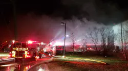 A Philadelphia firefighter was injured battling a two-alarm blaze at a Waste Management trash recycling facility in the city's Holmesburg section Sunday night.