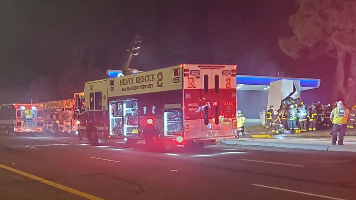 San Francisco firefighters rescued a driver from a fiery car crash after he struck a fuel storage tank at a gas station early Friday.