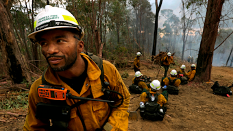 Leonard Dimaculangan, of Pasadena, CA, and a Texas canyon hotshot captain, leads a group of American firefighters in Australia's Alpine National Park on Jan. 18, 2020.