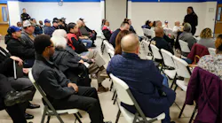 Dr. Chris Dillard, supervisor of the board of trustees in Buena Vista, MI, discusses a proposed merger of township police and fire departments with residents and stakeholders at a town hall meeting on Jan. 3, 2020.