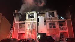 A Virginia Beach, VA, firefighter continued battling a two-alarm condo blaze after being injured by falling debris early Wednesday.