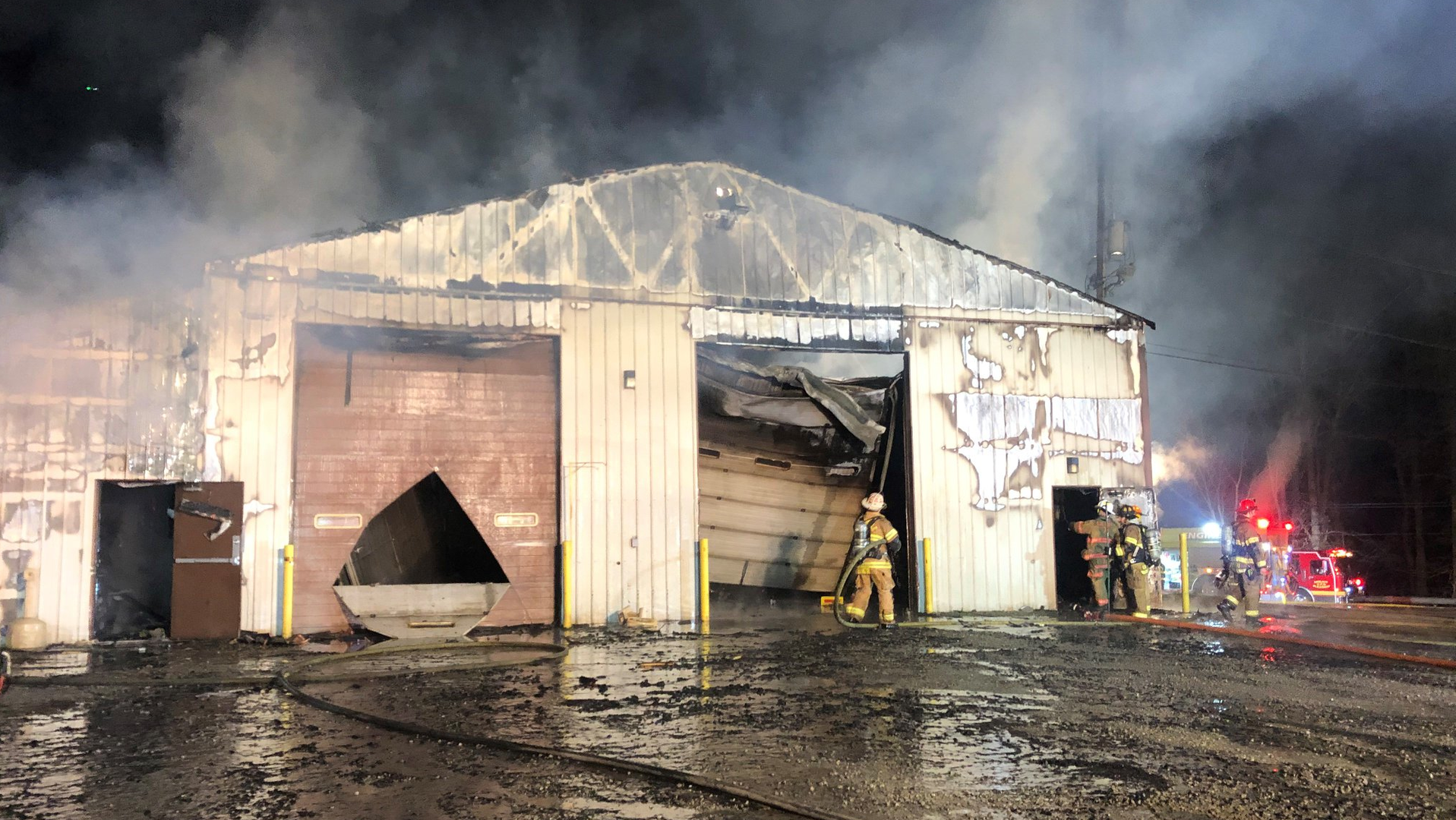 The scene at the East Huntingdon garage after the fire was brought under control.