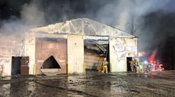 The scene at the East Huntingdon garage after the fire was brought under control.