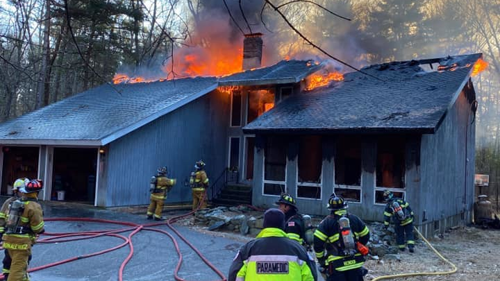 Firefighters battled a three-alarm fire after police and an ambulance were dispatched to medical alarm activation.