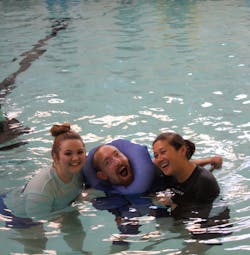 Richmond, VA, Fire Department firefighters attended the event in support of the swimmers who have physical disabilities. Richmond, VA, Fire Department firefighters attended the event in support of the swimmers who have physical disabilities.