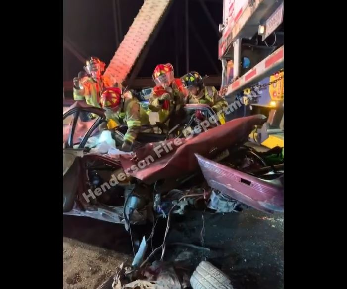 Henderson firefighters rescued an the driver after his vehicle was struck by a tractor-trailer.