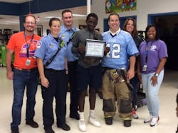 Members of the Burton, SC, Fire District attended an award ceremony for a student in the community. The ceremony took place on a day when students were encouraged to wear shirts that represented their college of choice. Firefighters did the same, to become a part of the school’s special day and to become a part of their community. Members of the Burton, SC, Fire District attended an award ceremony for a student in the community. The ceremony took place on a day when students were encouraged to wear shirts that represented their college of choice. Firefighters did the same, to become a part of the school’s special day and to become a part of their community.