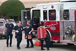 White Settlement firefighters return their equipment to Engine 18 after treating victims at the West Freeway Church of Christ. White Settlement firefighters return their equipment to Engine 18 after treating victims at the West Freeway Church of Christ.