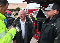 White Settlement Fire Chief Mark Ball (center) and Assistant Chief Brandon Logan talk with Fort Worth Fire Department Public Information Officer Mike Drivdahl.