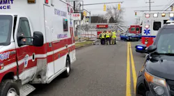 Canton, OH, police investigate a crash involving an ambulance (left) and Kia Forte that injured five Wednesday.