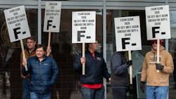 Chicago firefighters rally in front of the city's public safety headquarters in protest of problems during a recent promotional exam. Chicago firefighters rally in front of the city's public safety headquarters in protest of problems during a recent promotional exam.