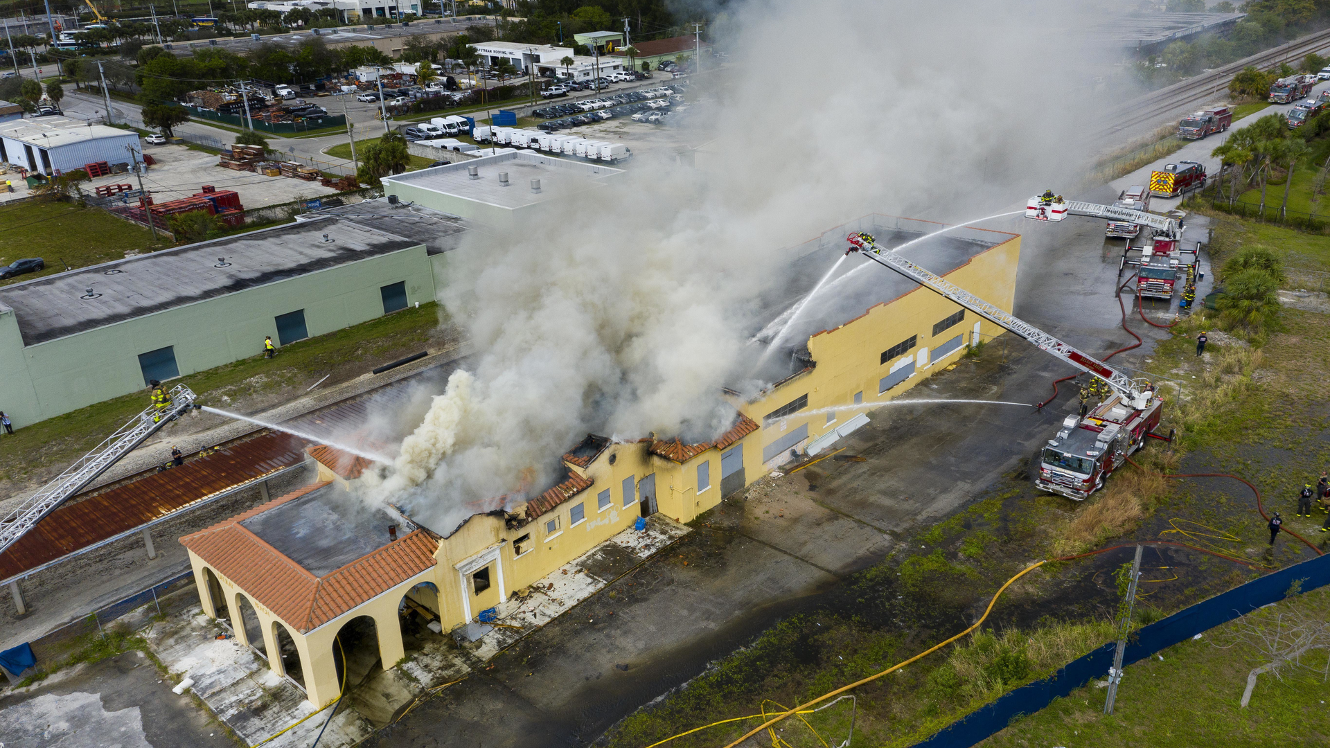 Delray Beach, FL, firefighters work to put out flames after a defunct train station caught fire Tuesday.